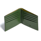 Green leather wallet open on a white background
