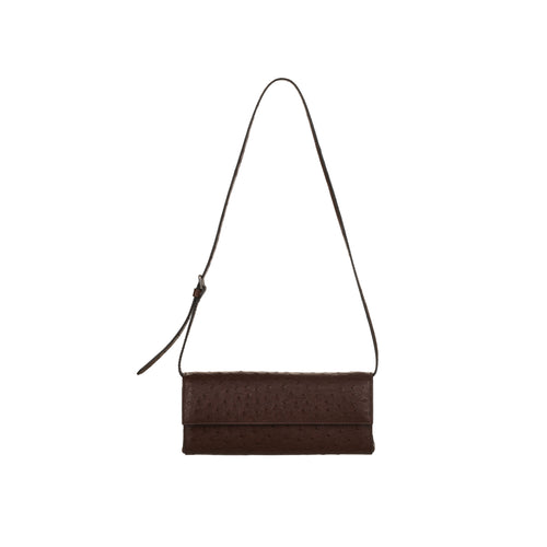 Brown textured clutch bag with a strap on a white background