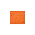 Orange textured wallet on a white background