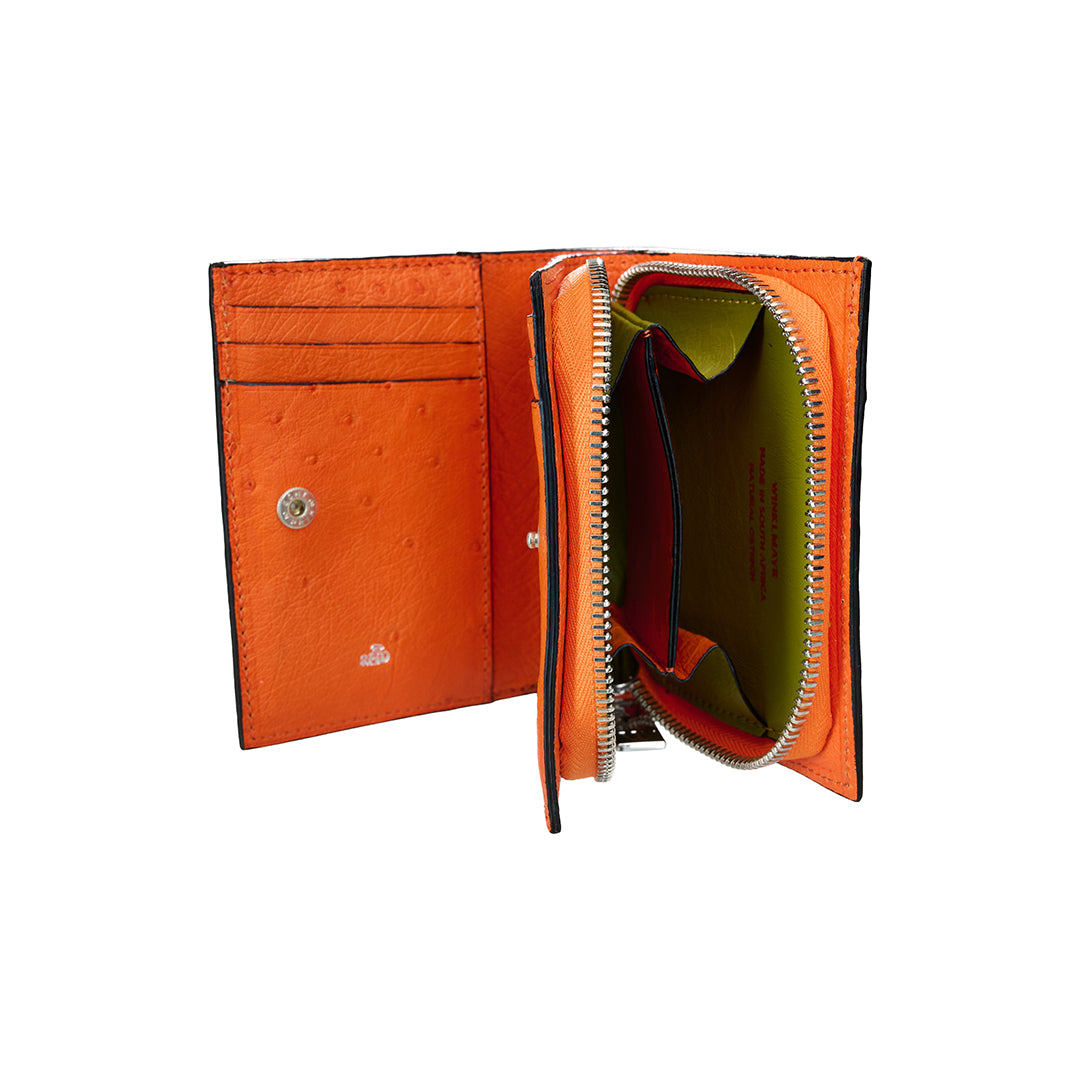 Orange leather wallet with a zipper on a white background