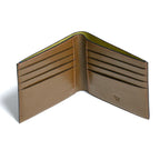 Open beige leather wallet on a white background