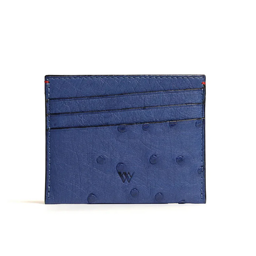 A blue card holder with multiple card slots and a small amount of cash, made from ostrich quill leather.