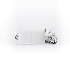 A white luxury leather purse with a geometric pattern, featuring a removable link strap and multiple compartments.