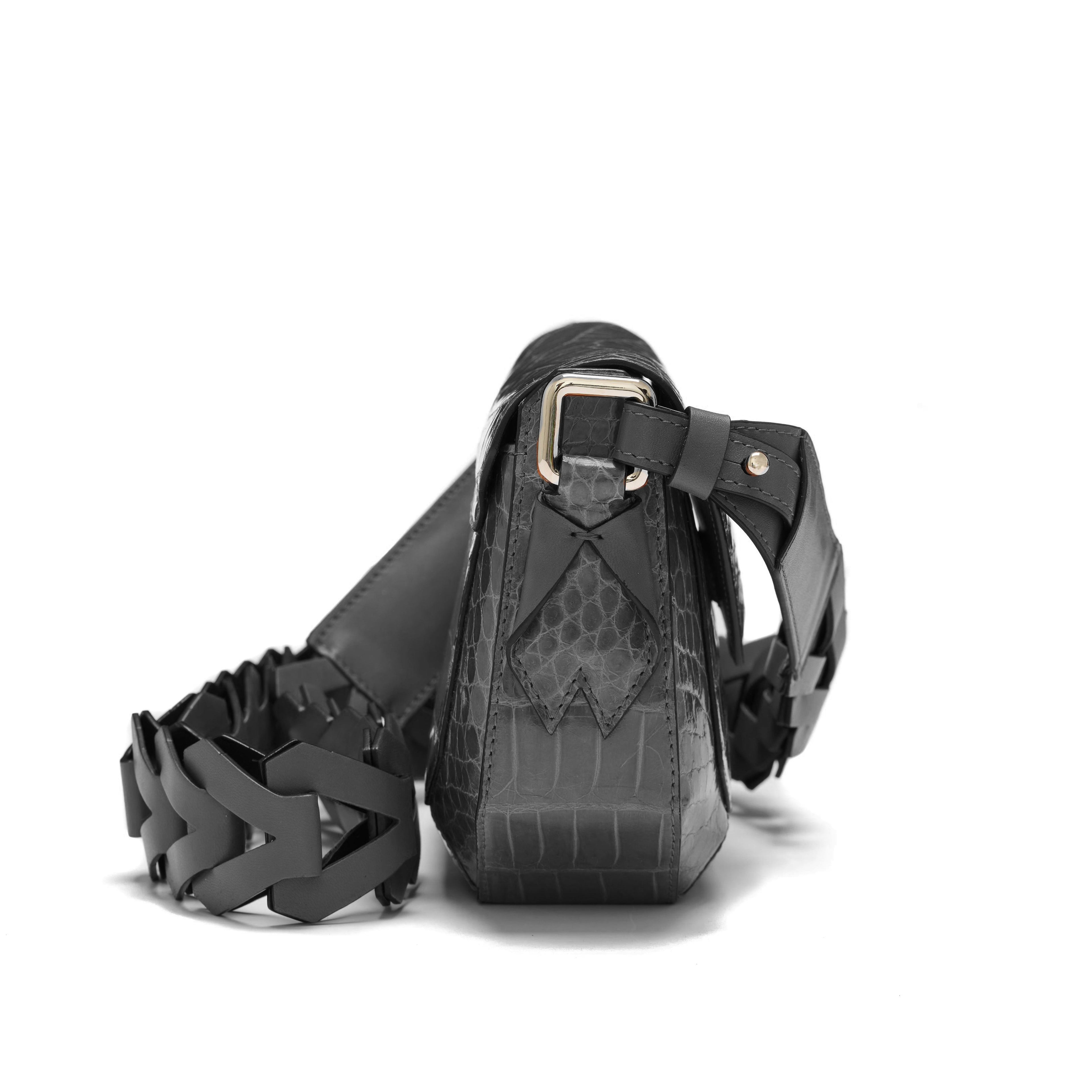 Black leather harness with intricate design on a white background