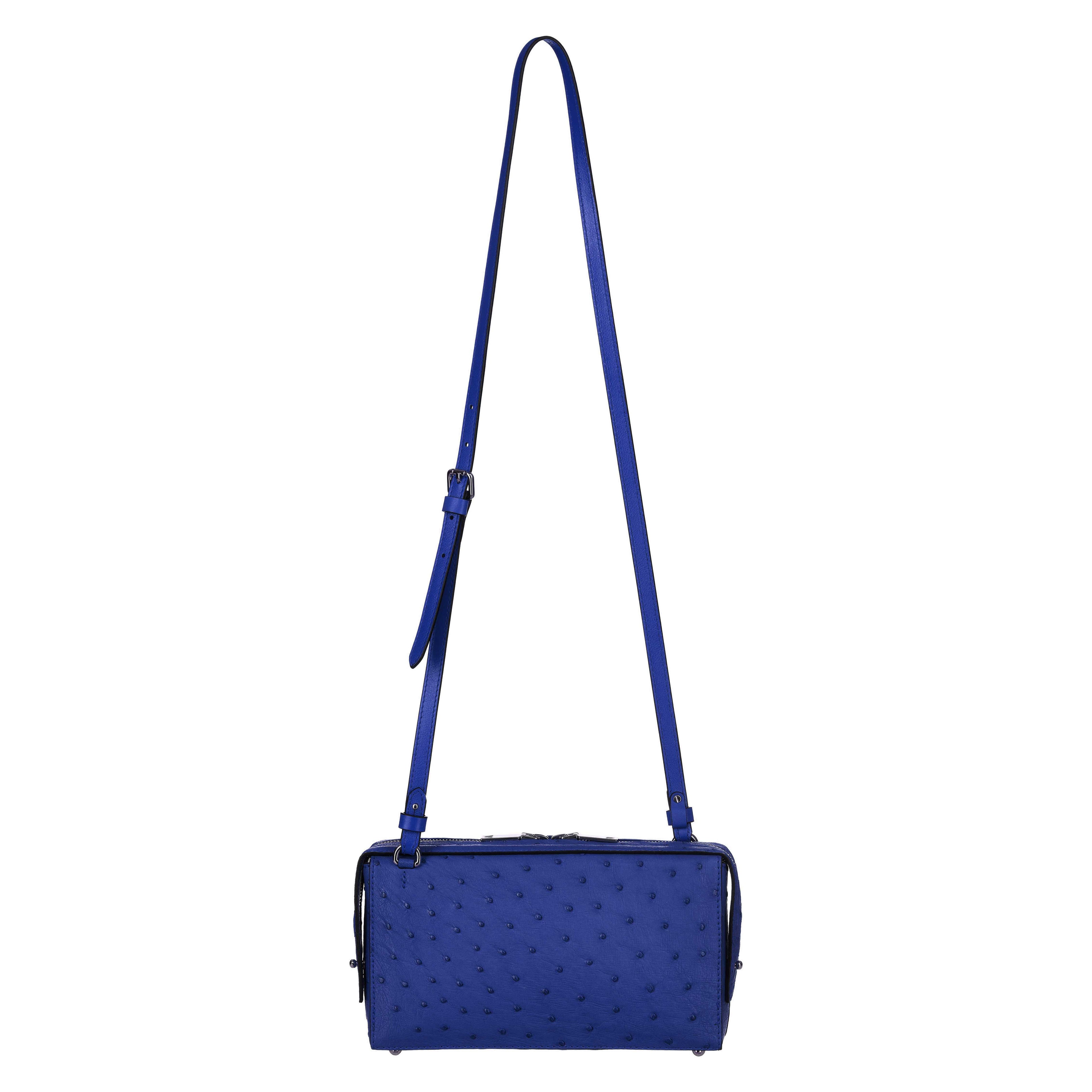 Black textured handbag with a strap on a white background