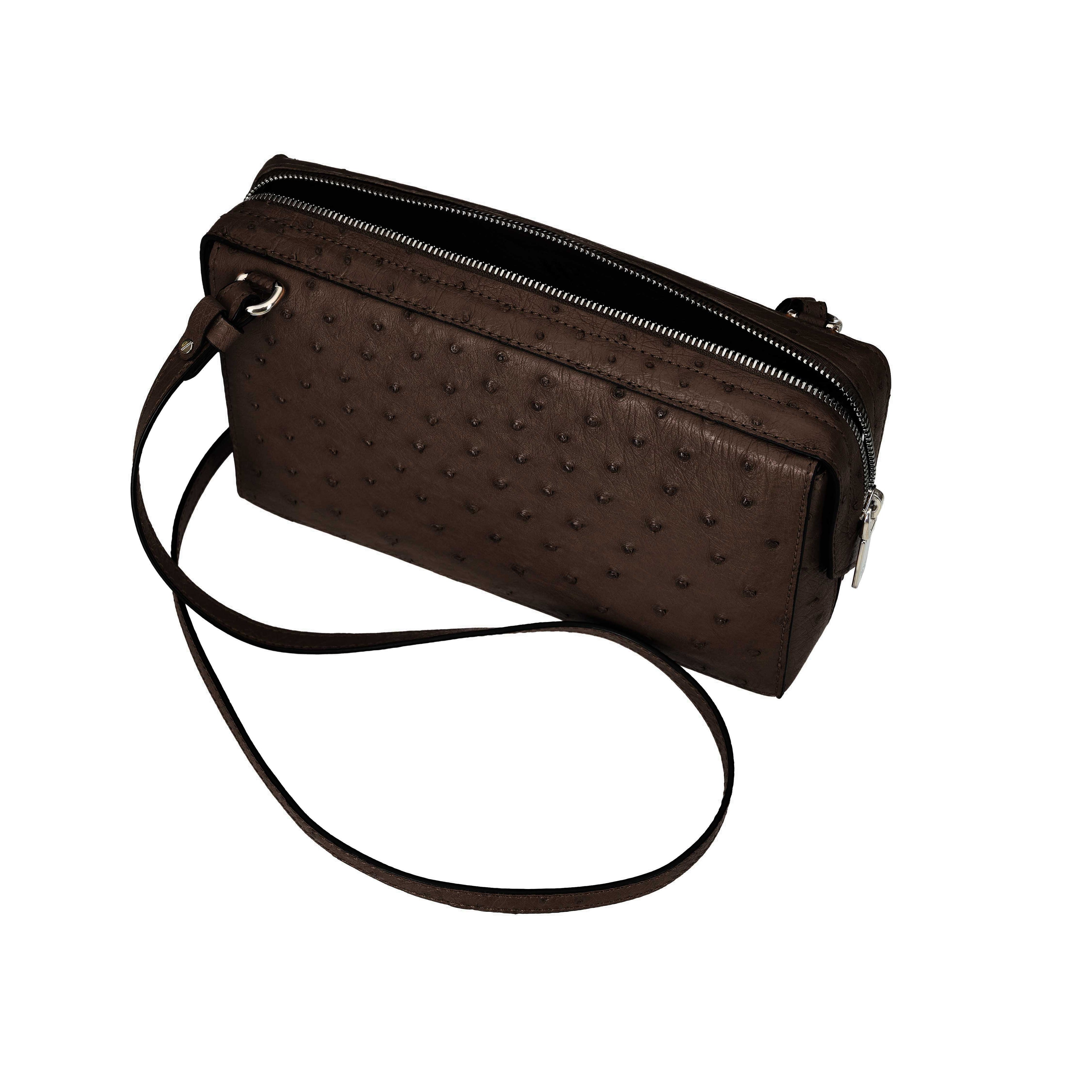 Brown textured handbag with a strap on a white background