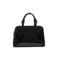 A black luxury handbag with a structured design, featuring two handles and a detachable strap.