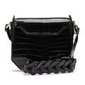 Black crocodile-patterned handbag with a braided handle on a white background
