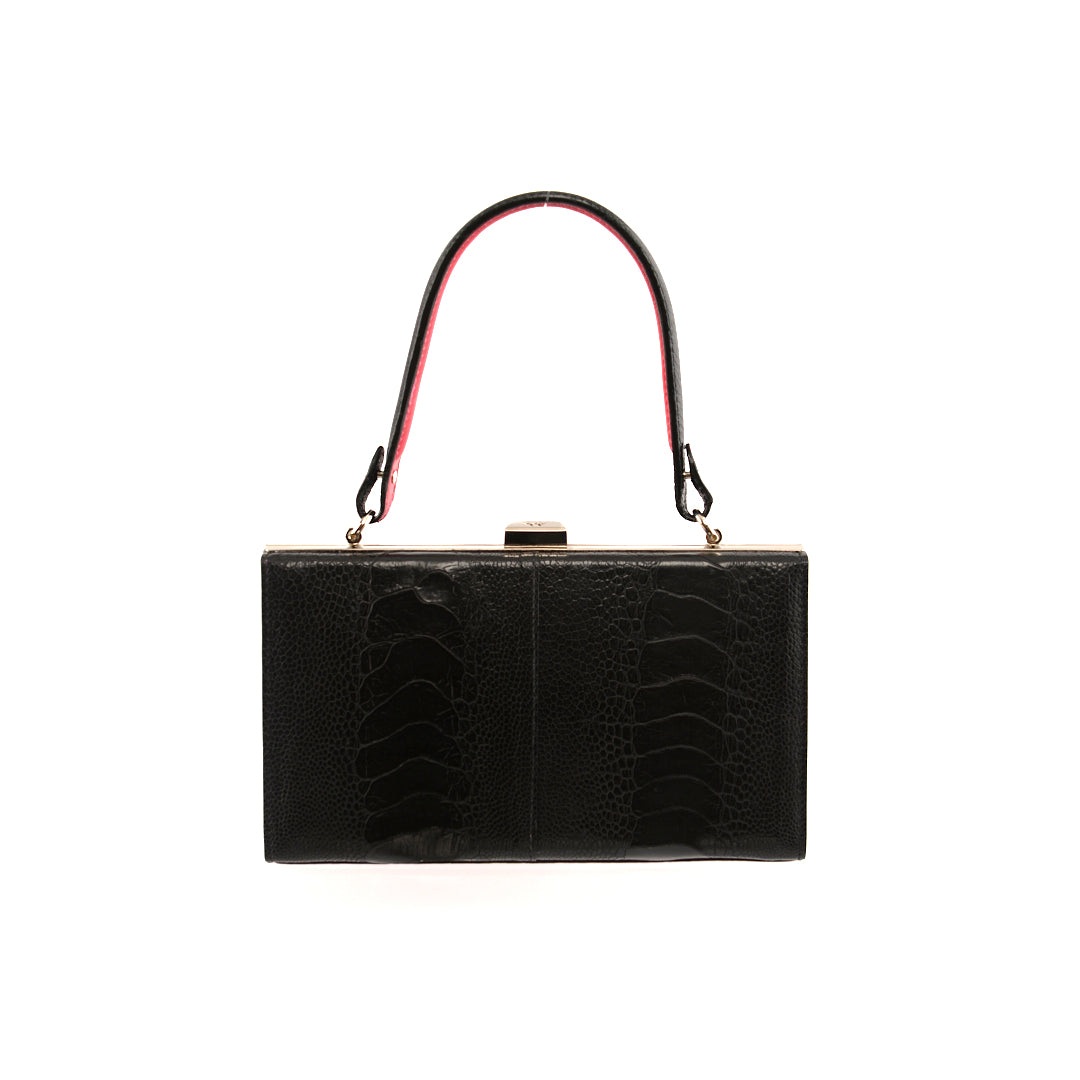A black luxury leather purse with a light pink gusset, a removable link strap, and a secure back pocket.