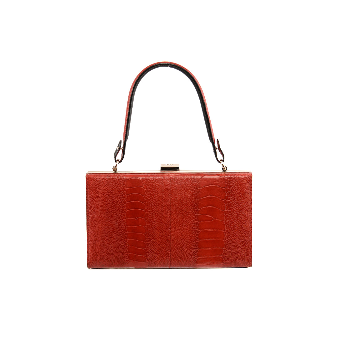 A red leather purse with a crocodile pattern and a metallic clasp, suitable as a big wallet or a small handbag.