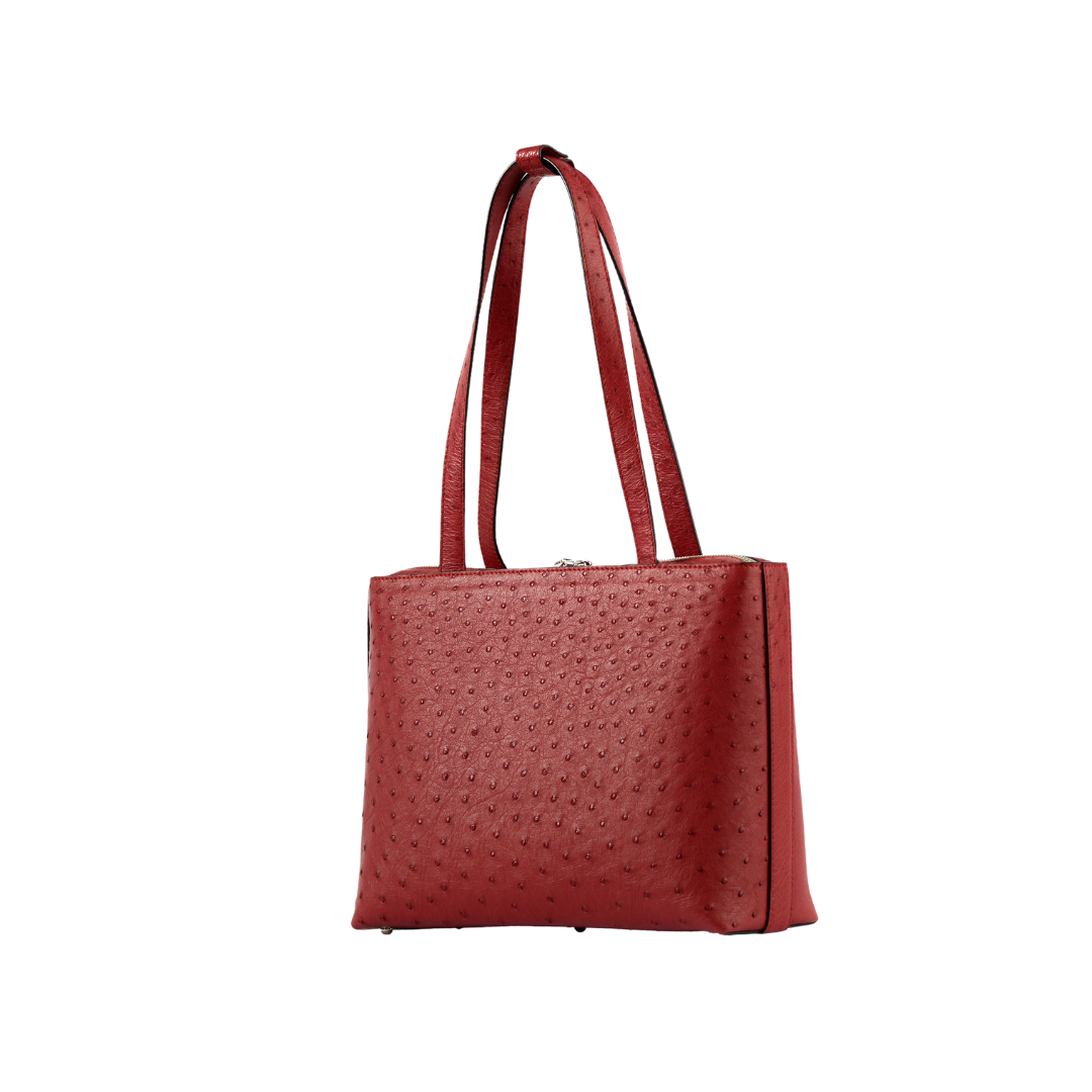 Red textured handbag on a white background