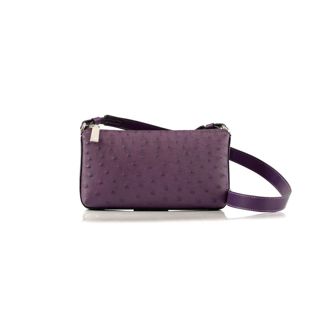A compact, African violet colored leather handbag with a long strap, featuring a textured pattern.