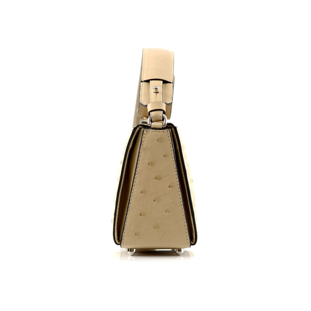 Gold handbag with a strap on a white background
