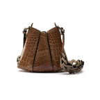 A nude-colored handbag with a crocodile pattern, featuring a clasp closure and a removable strap.