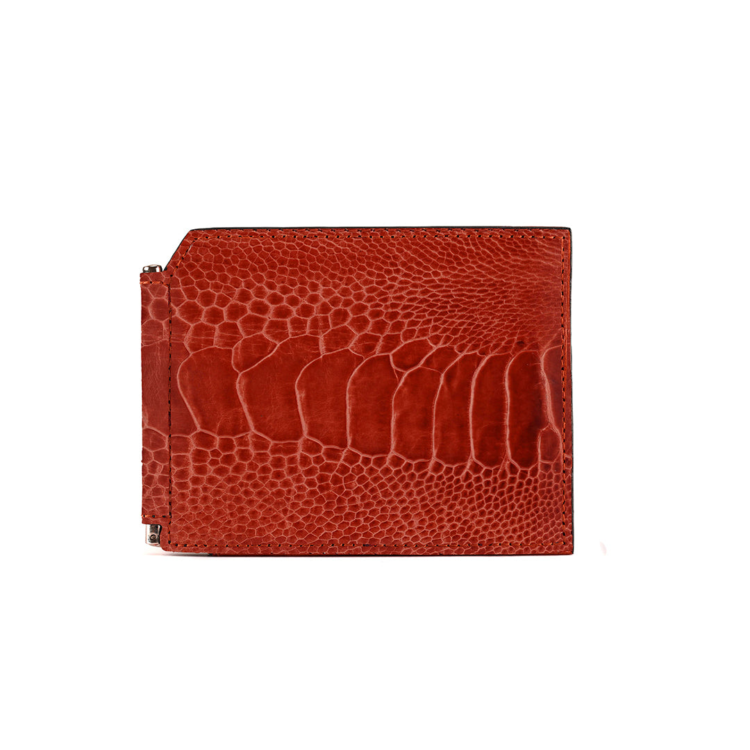 Red leather wallet with crocodile texture on a white background