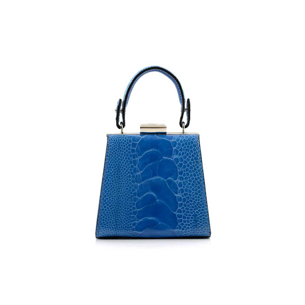 A blue leather handbag with a structured design, featuring a top handle and a shiny metal closure.