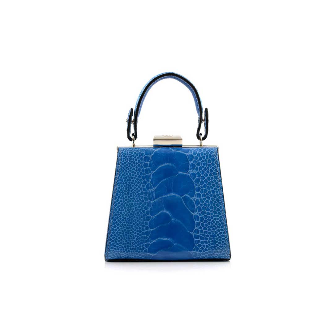 A blue leather handbag with a structured design, featuring a top handle and a shiny metal closure.