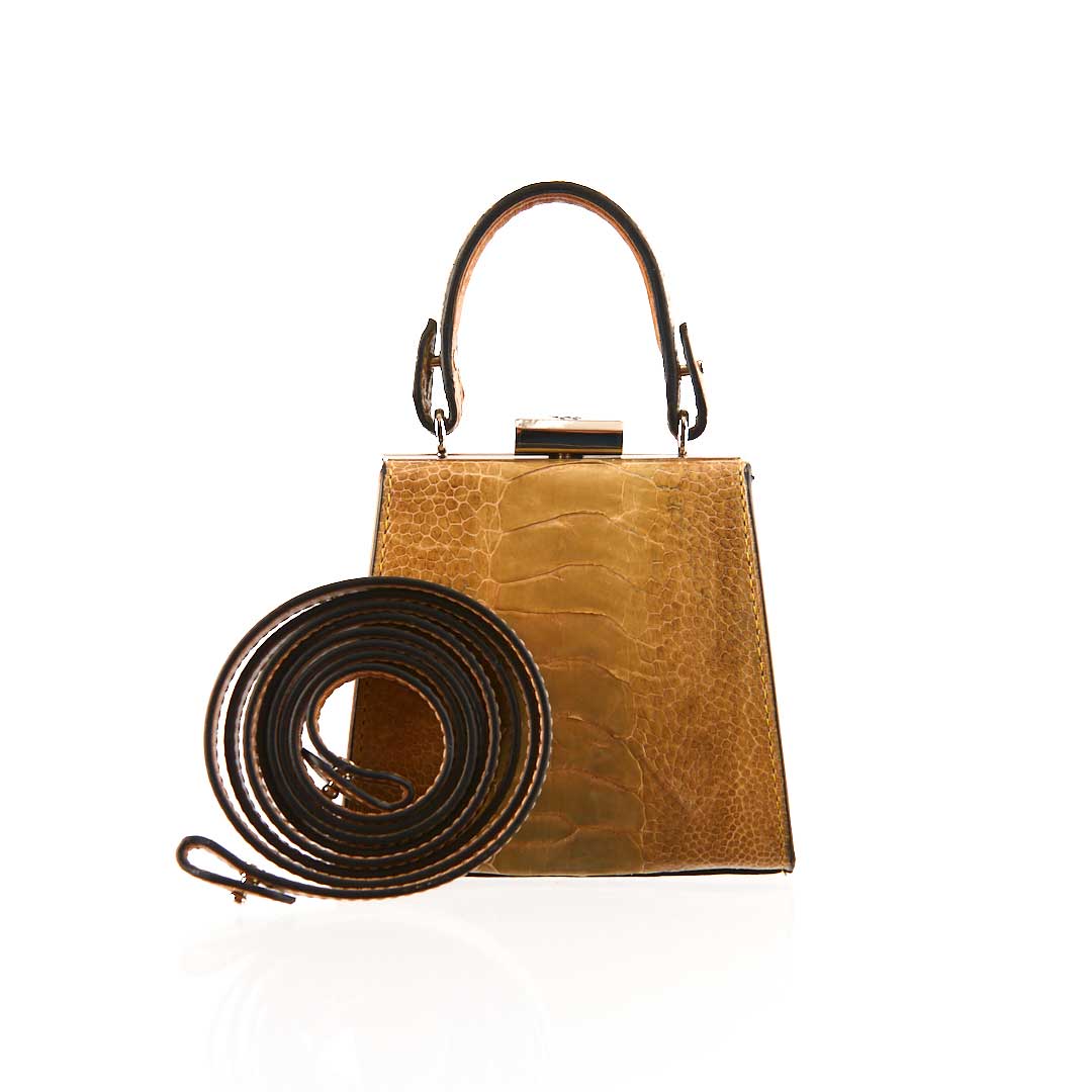 Brown handbag with strap on a white background