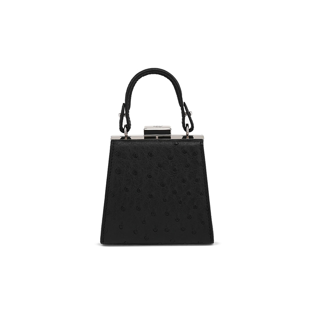 A black leather handbag with a textured pattern and a removable handle.
