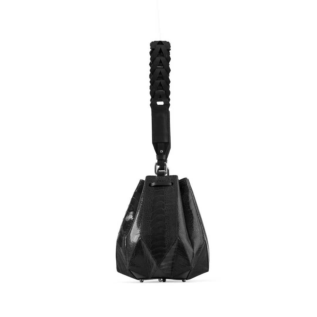 Black sandbag with textured handle on a white background