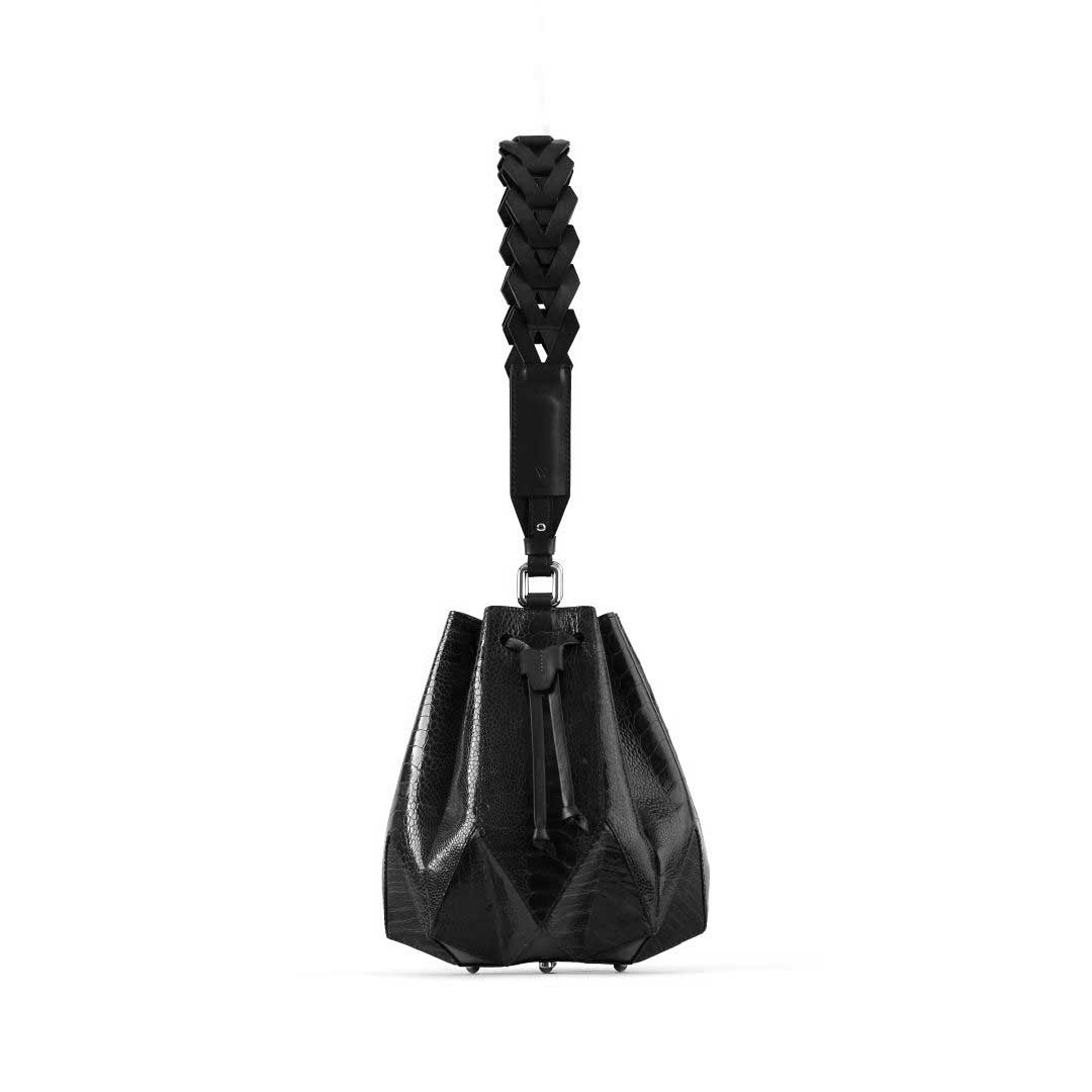 Black geometric handbag with braided handle on a white background