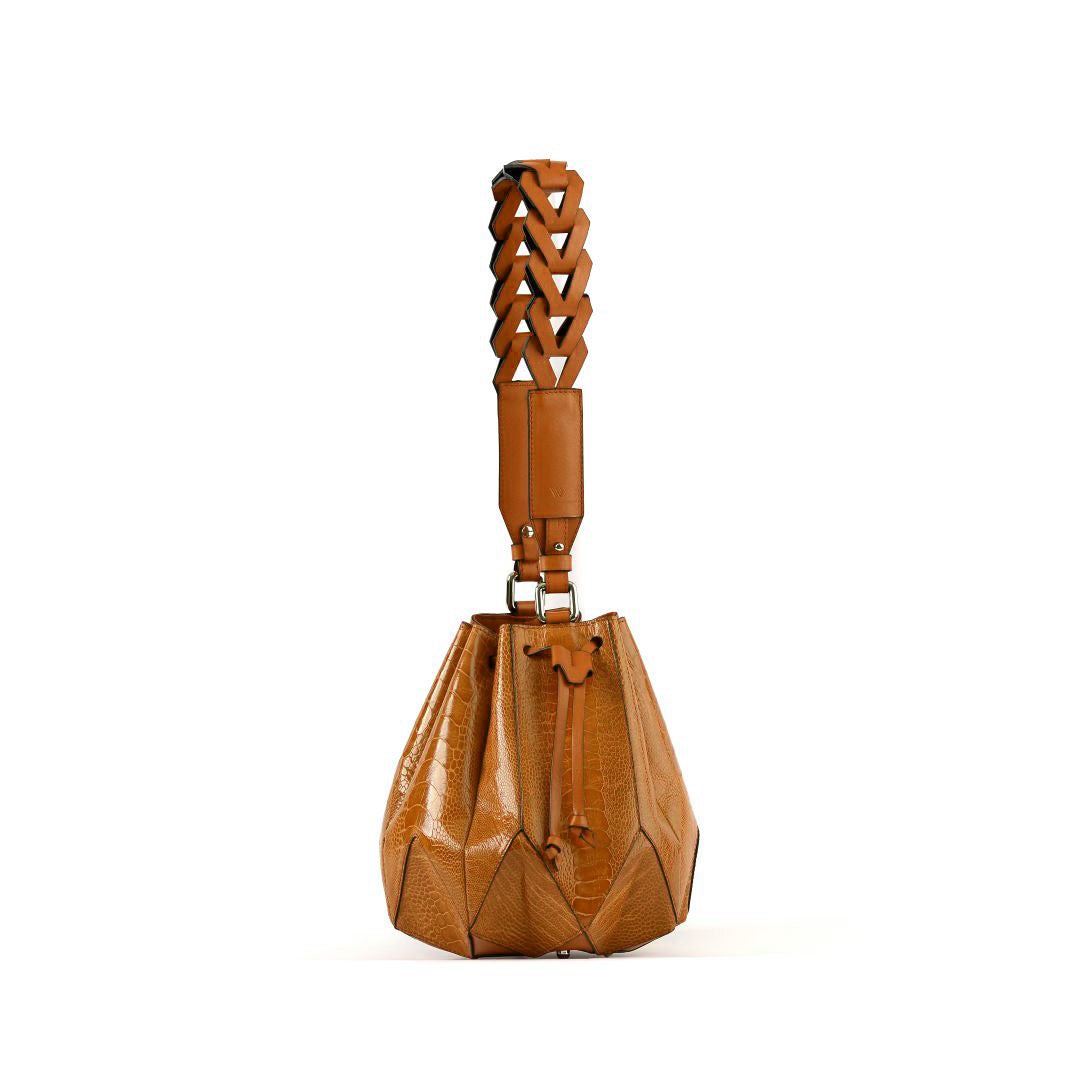 Brown leather handbag with geometric design on a white background