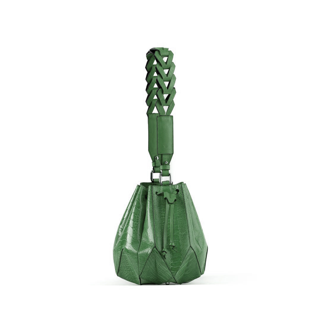 Green handbag with geometric design on a white background