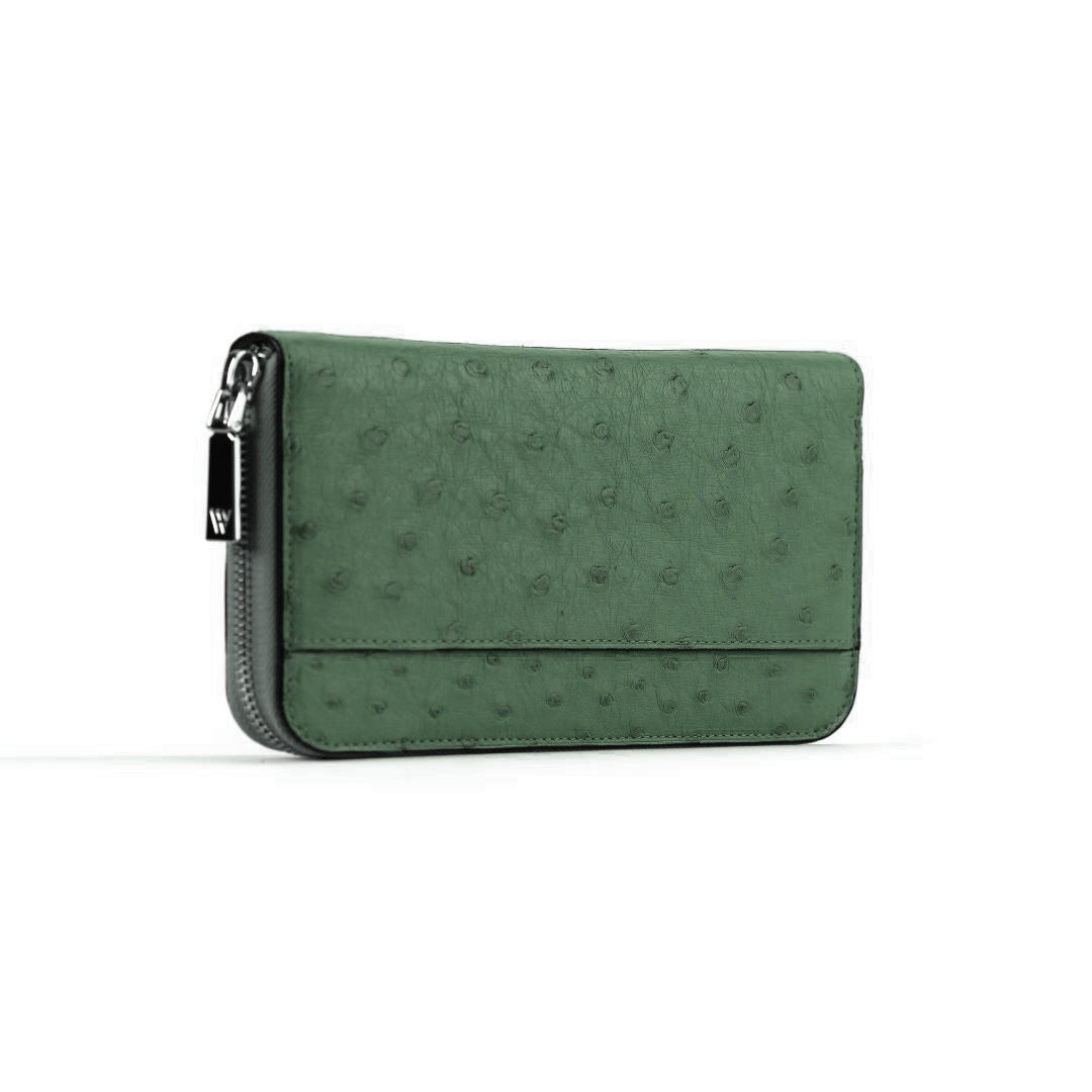 Green textured wallet with a zipper on a white background