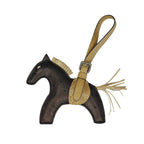 Horse-shaped keychain with a strap on a white background